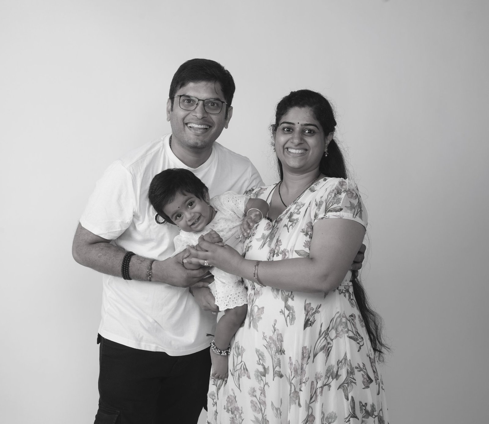 Family with baby smiling B&W